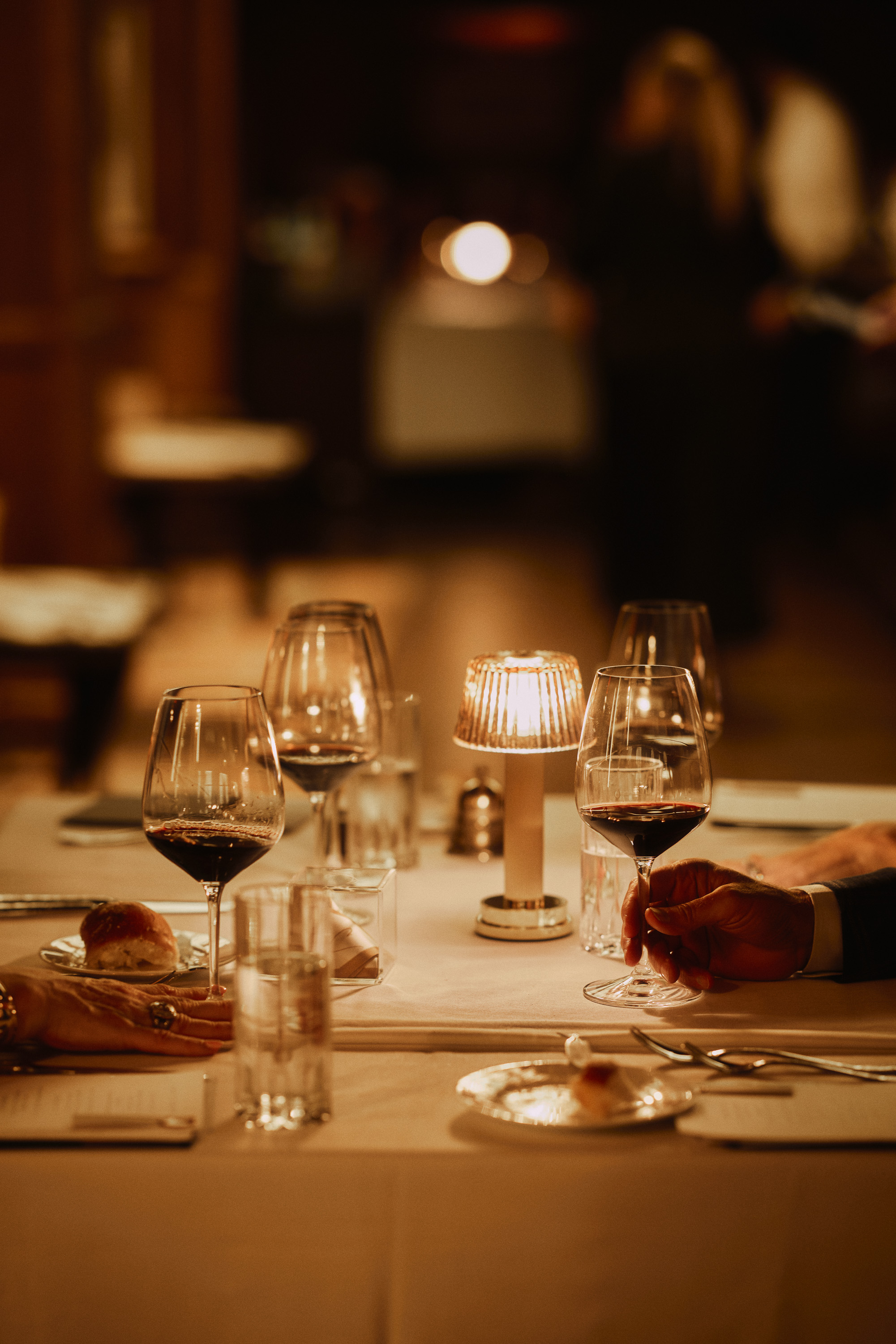 An elegantly set Cattlemen’s Club dining table with glassware and candlelight